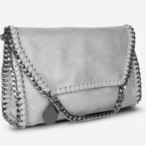 NWT, vegan leather Alicia Crossbody bag. Can be worn as clutch or crossbody.